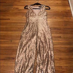 Lulu’s rose gold sequin jumpsuit.